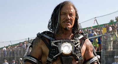 It looks like someone has finally tamed Mickey Rourke's wild streak by making him wear an over-sized shock collar