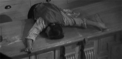 The bar's holding him up...