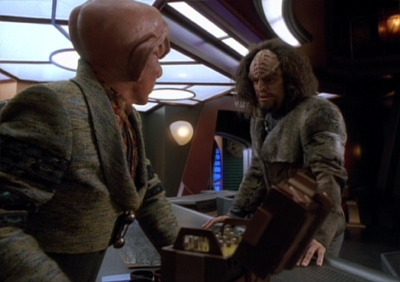 Wait... why did Quark need to let the guy carry his weapon to make this deal?