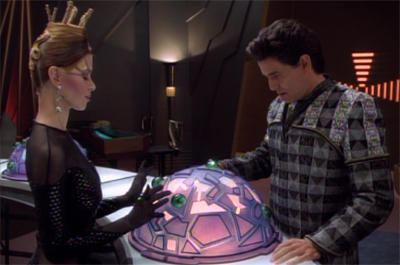 He doesn't seem too bothered about letting her play with his sphere...