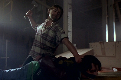 Burying the hatchet... into his victim's skull...