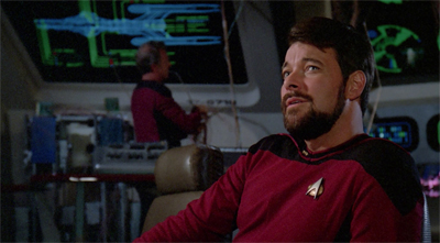 Riker looks like he's trying really hard to fight the urge to order a lazyboy installed as his command chair...