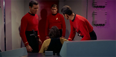 "He's unconscious." "But he's the one in the gold shirt!" "What do we do?" "I don't know! We're not trained for this!"