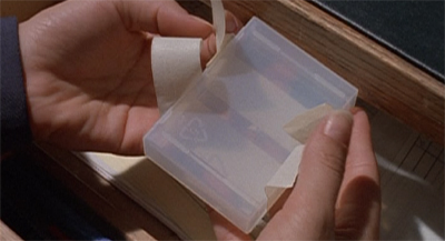 Taped to the desk...