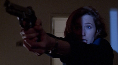 Scully has had it with Mulder's quips about her driving...