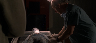 "You know, I'm starting to wonder if his alien family would be cool with us filming his autopsy like this?"
