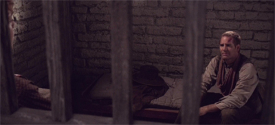 "Dammit. I thought we were past the point in the show where I got randomly thrown in jail..."