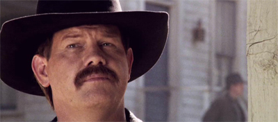 This man is the sheriff. You can tell by his awesome moustache.