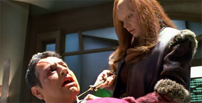 And with that, we're out of the "female cast members" point phallic objects at Chakotay section of the episode...