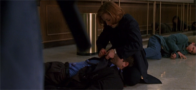 Well, there is probably a less contrived way to have Scully take Mulder's shirt off...