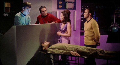 "Doctor McCoy has lost the surgical knowledge he obtained from the teacher. He has been drawing on his own skills and surgical techniques in an attempt to continue the operation, but he is faltering and uncertain. In a desperate hope that he can draw on Spock's brain for assistance, I instructed Doctor McCoy to give priority to connecting Spock's vocal chords."