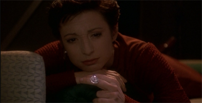 Braceletting herself for what will follow.